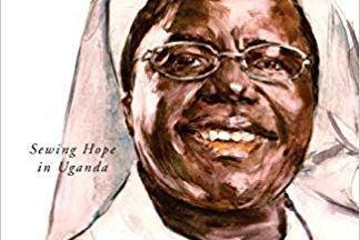 Sister Rosemary smiling jovially in a white habit