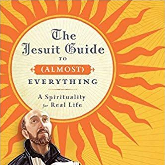 Cover of the book showing a statue of St. Ignatius against a yellow and orange background